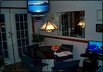 Eating area beside kitchen with high speed internet access and tv